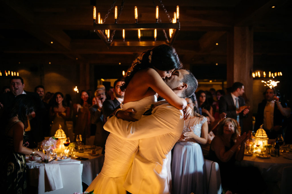A bride and groom kiss at a wedding held at Ristorante Beatrice.